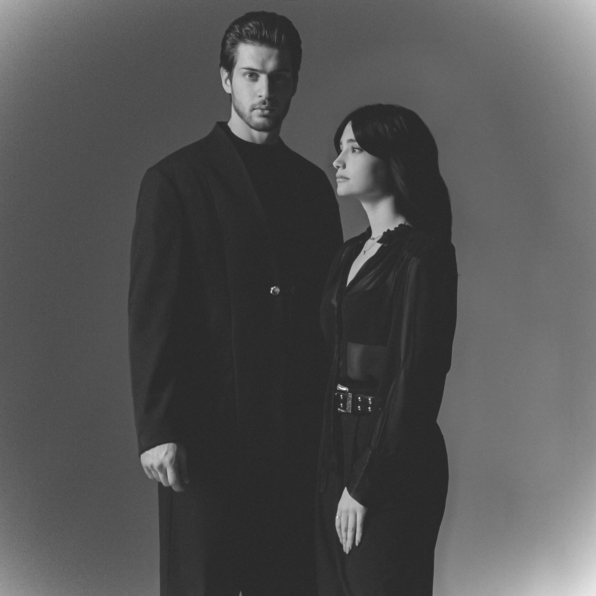 Laura and Luca together in a black-and-white studio portrait